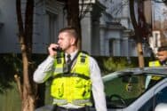 Security guard talking into walkie talkie